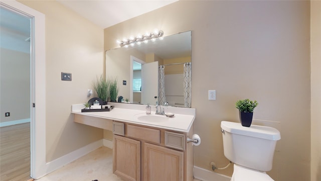 bathroom with tile patterned floors, vanity, and toilet