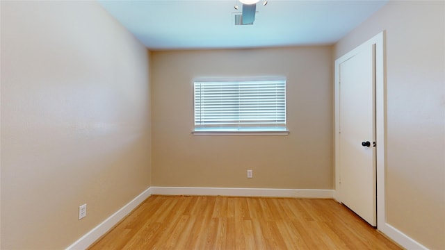 spare room featuring light hardwood / wood-style flooring