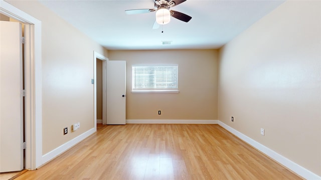 spare room with ceiling fan and light hardwood / wood-style flooring