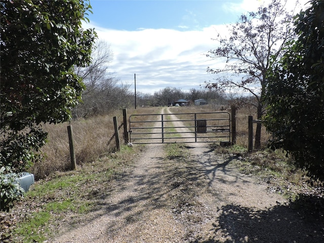 view of gate featuring a rural view