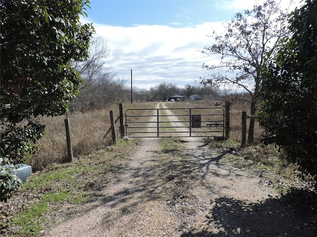 view of gate featuring a rural view