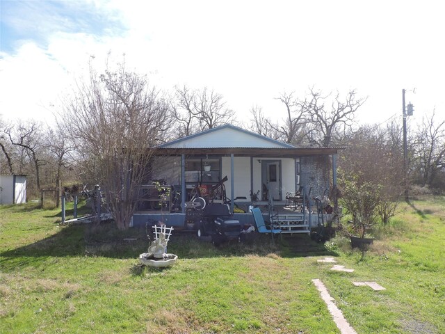 exterior space with a porch and a yard