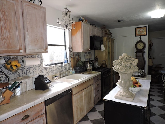 kitchen featuring light brown cabinets, sink, tile counters, and black appliances