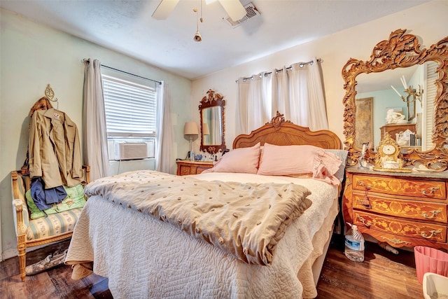 bedroom featuring ceiling fan, cooling unit, and dark hardwood / wood-style floors