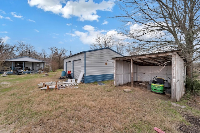 view of outdoor structure featuring a yard