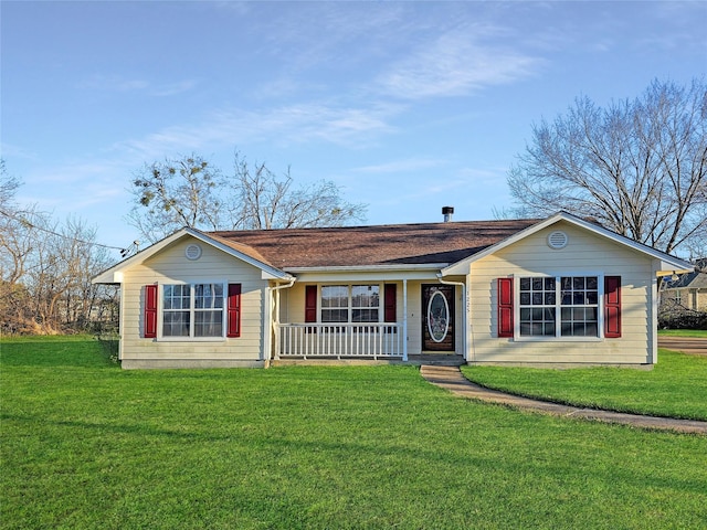 ranch-style house with covered porch and a front lawn