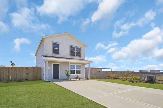 rear view of property with a yard