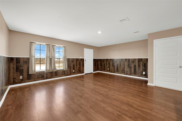 unfurnished room featuring dark hardwood / wood-style floors