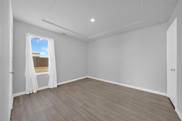 empty room featuring wood-type flooring