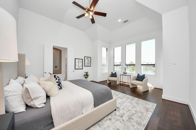 bedroom with ceiling fan, dark hardwood / wood-style floors, and lofted ceiling