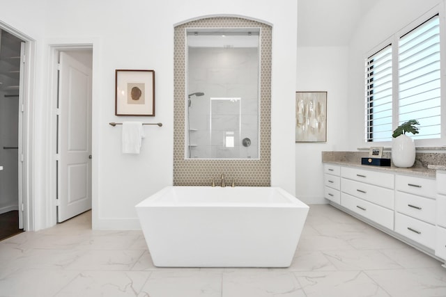 bathroom featuring vanity and independent shower and bath