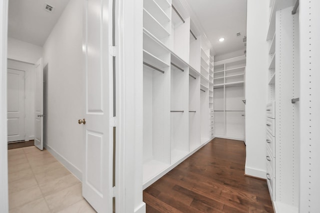 spacious closet featuring hardwood / wood-style flooring