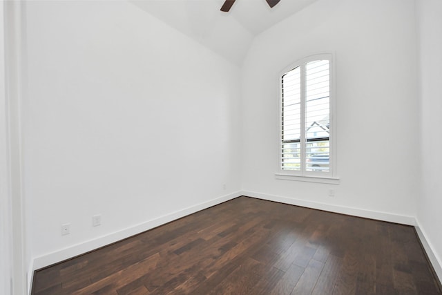 empty room with dark hardwood / wood-style floors, ceiling fan, and lofted ceiling