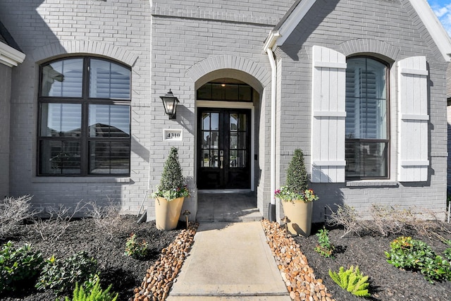 view of exterior entry featuring french doors