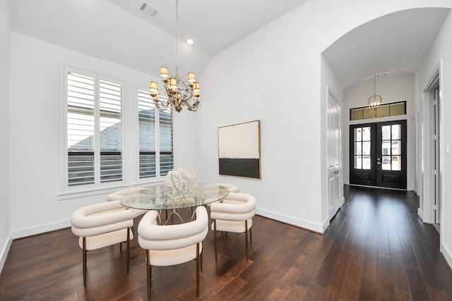 dining space featuring french doors, an inviting chandelier, plenty of natural light, and lofted ceiling