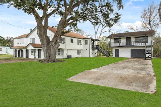 exterior space featuring a garage and a front lawn