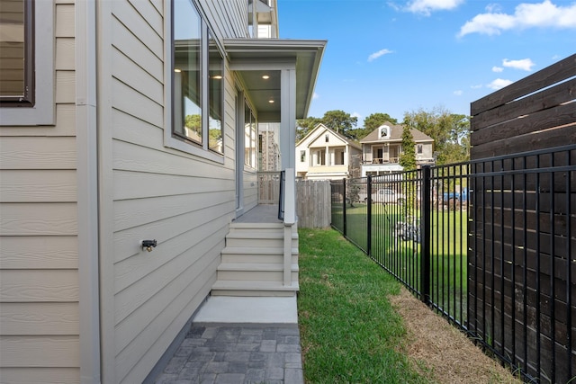 view of side of property with a lawn