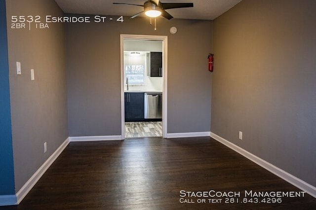 unfurnished room featuring dark hardwood / wood-style floors and ceiling fan