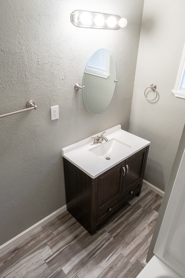 bathroom featuring vanity and wood-type flooring