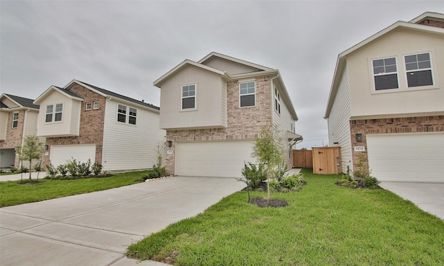 view of front of property featuring a garage and a front yard