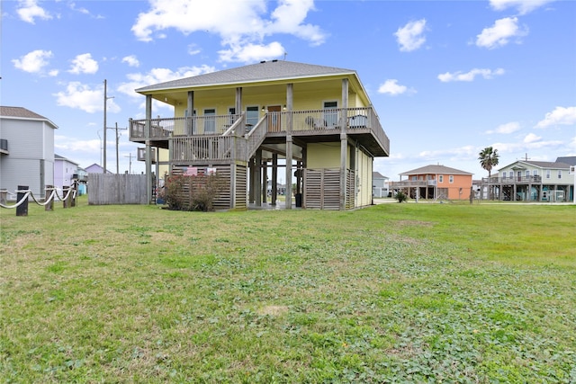 rear view of property with a yard