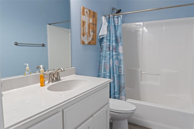 full bathroom with shower / bath combo, toilet, and vanity