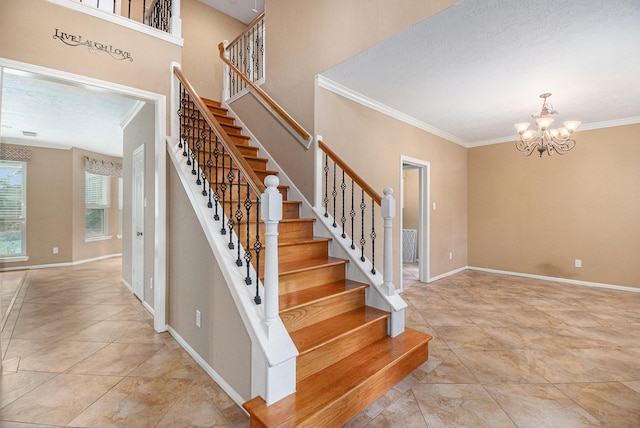 stairway with a textured ceiling, crown molding, and a notable chandelier