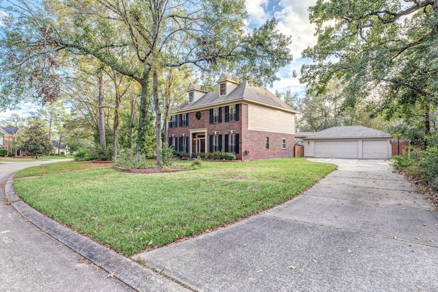 view of front of house featuring a front yard and a garage