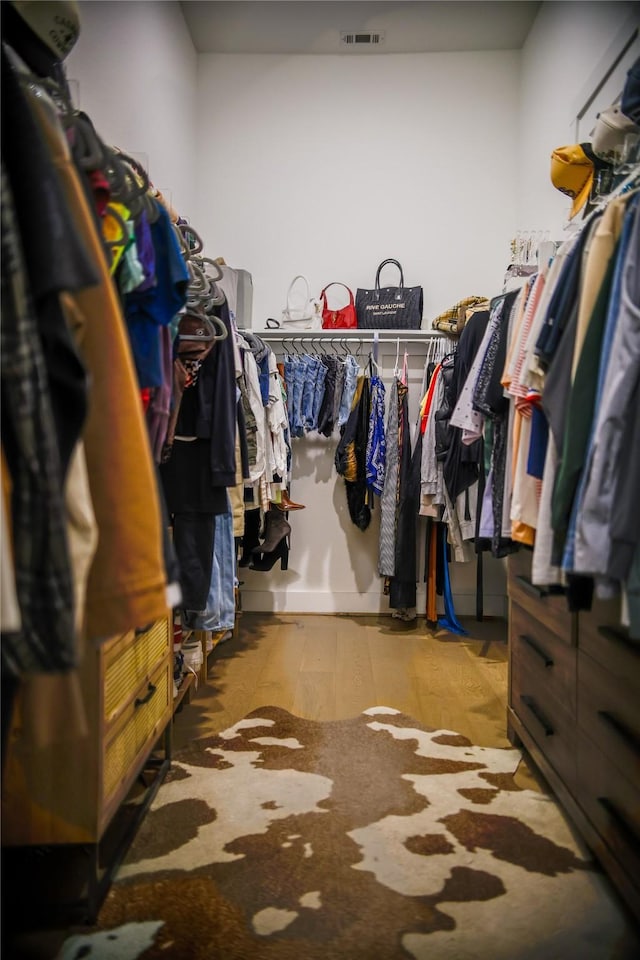 spacious closet featuring light hardwood / wood-style floors