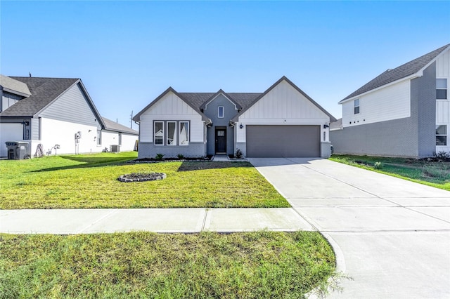 modern farmhouse with central air condition unit, a front lawn, and a garage