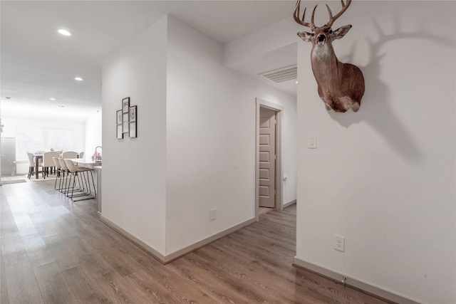 hallway featuring light hardwood / wood-style floors