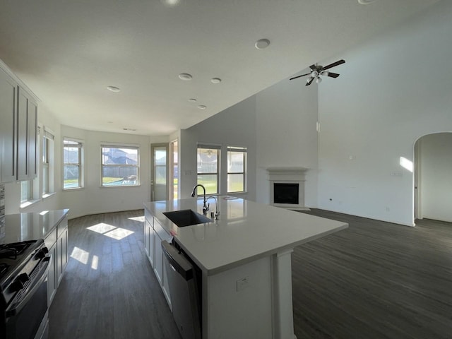 kitchen with white cabinetry, sink, an island with sink, and stainless steel appliances