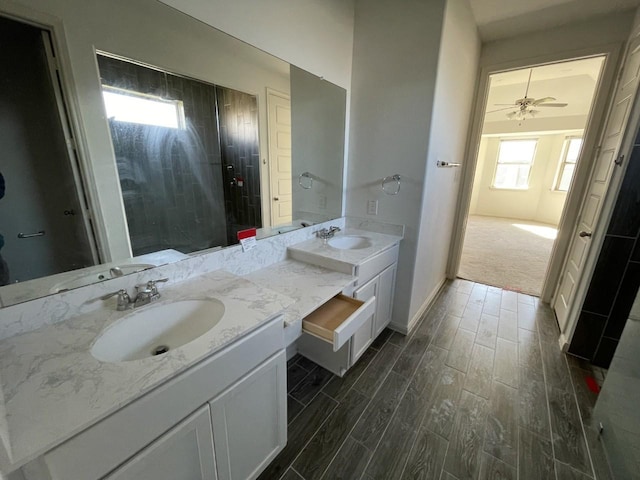 bathroom featuring ceiling fan and vanity