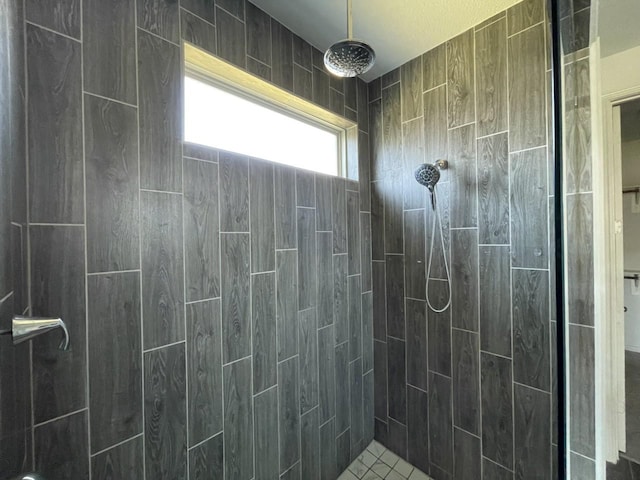 bathroom with tiled shower