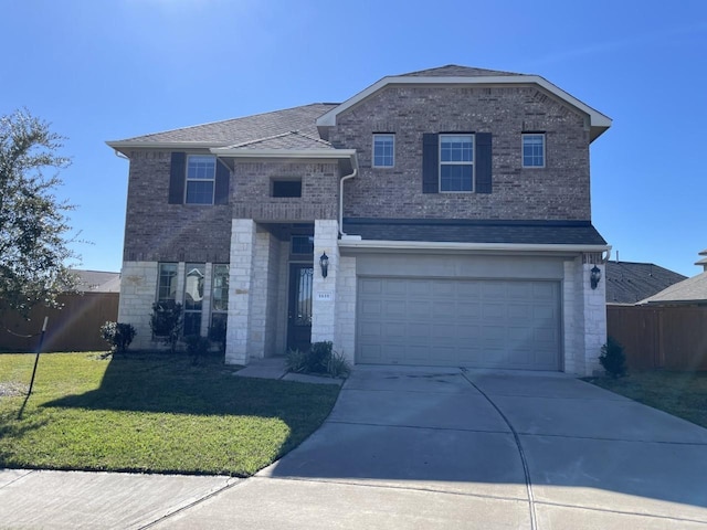 front of property featuring a garage and a front yard