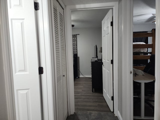 hallway with dark hardwood / wood-style flooring