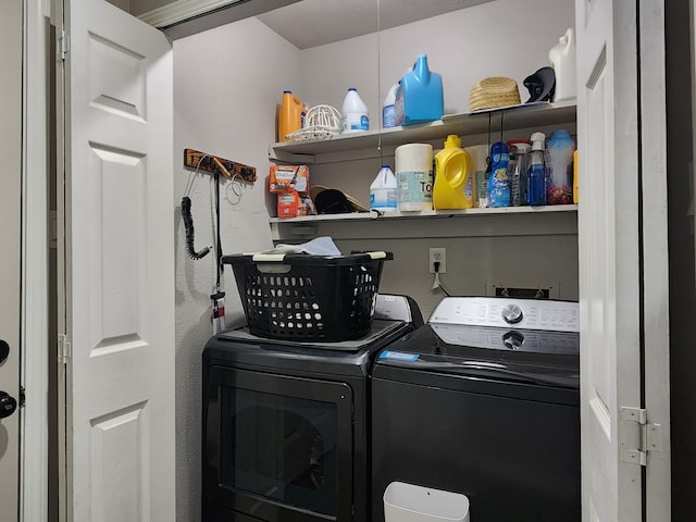 clothes washing area with washer and dryer