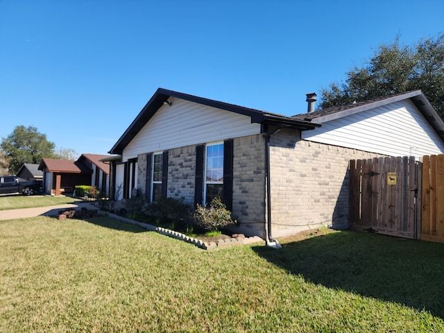 view of home's exterior featuring a yard