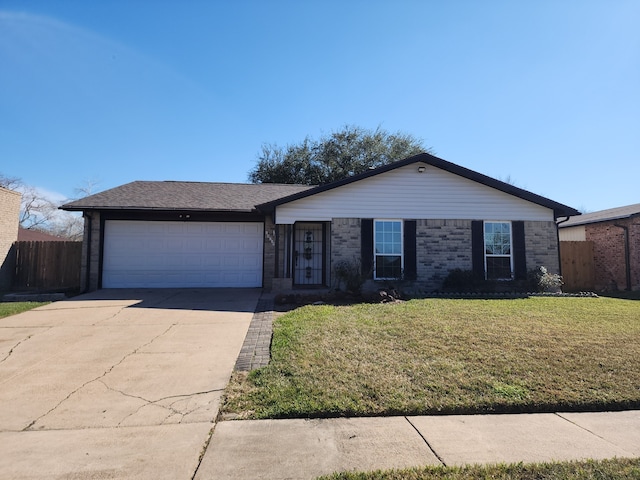 ranch-style home with a front lawn and a garage