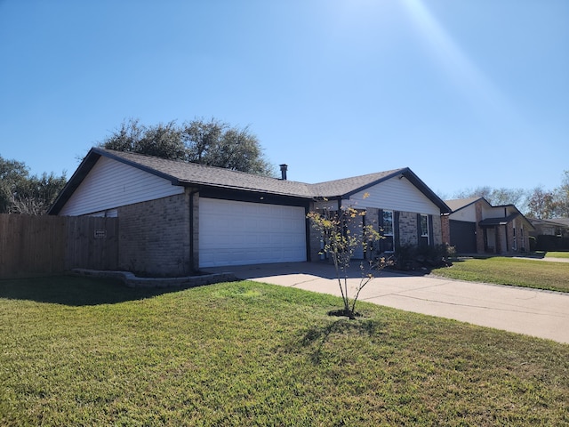 ranch-style home with a garage and a front lawn