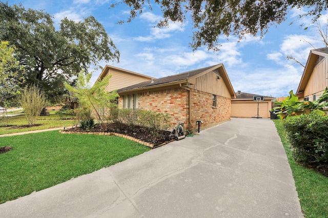 view of property exterior with a lawn and a garage