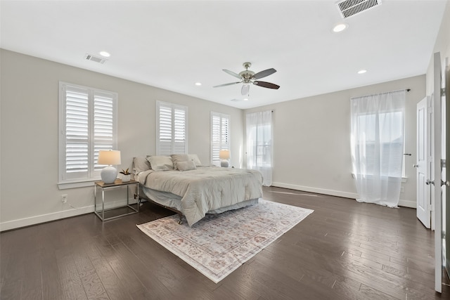 bedroom featuring ceiling fan and dark wood-type flooring