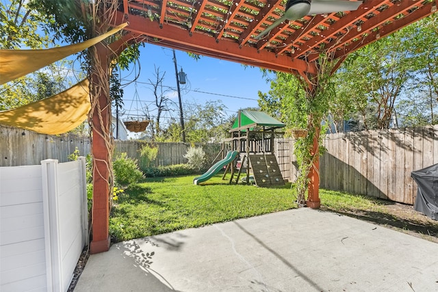 view of patio featuring a playground and a pergola