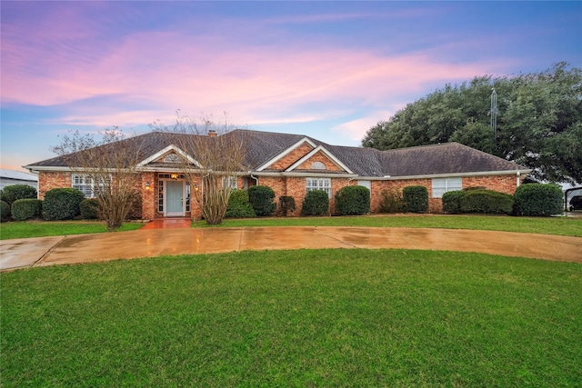 ranch-style house with a yard