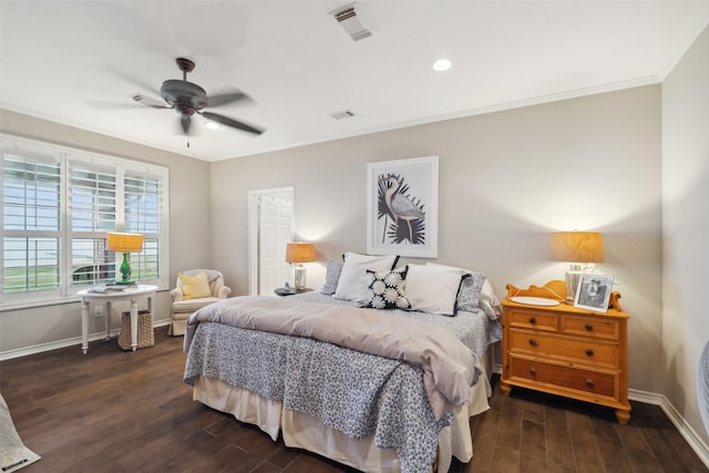 bedroom with dark hardwood / wood-style flooring, ceiling fan, and crown molding