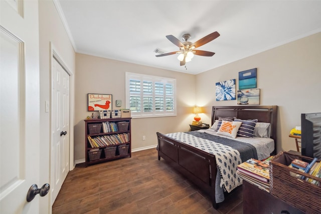 bedroom featuring ornamental molding, a closet, ceiling fan, and dark wood-type flooring