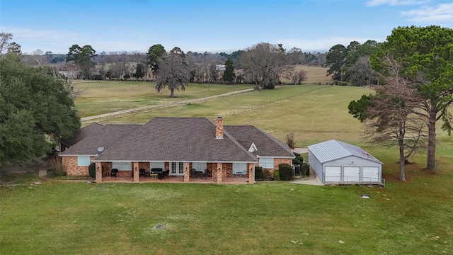 birds eye view of property featuring a rural view