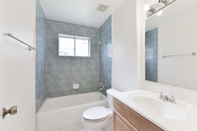 full bathroom featuring vanity, toilet, and tiled shower / bath