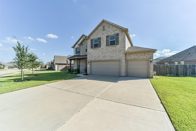 view of front facade with a front yard and a garage