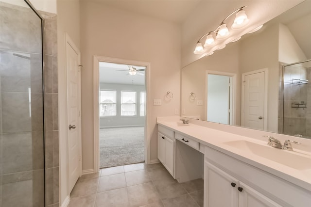 bathroom featuring tile patterned floors, ceiling fan, and vanity